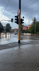 Rainy evening street intersection captured by witnesses