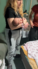 Family captures quiet moments with newborn, pets at home