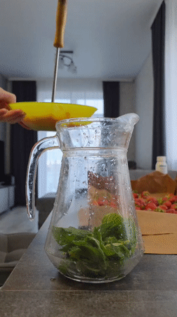 Homemade strawberry-mint drink preparation documented in Russian village