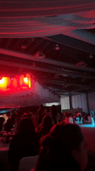 Large gathering fills Mexico City banquet hall with stage lighting
