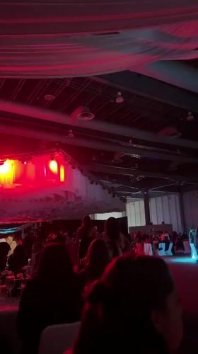 Large gathering fills Mexico City banquet hall with stage lighting