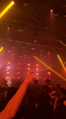 New York nightclub packed under red and yellow DJ lights