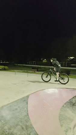 Mountain biker navigates skate park features in Dobrich