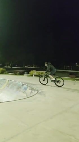 Mountain biker navigates skate park features in Dobrich