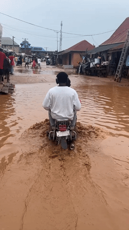 Flooding and street life in Ihiagwa, Nigeria