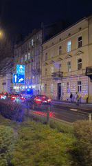Nighttime street activity captured in central Krakow