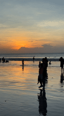 Families enjoy sunset beach time in Kuta Selatan