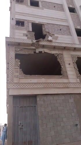 Jeddah street life: soccer games, aircraft overhead, damaged building