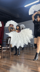 Feather fan dance rehearsal underway in a Mexican studio