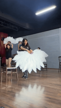 Feather fan dance rehearsal underway in a Mexican studio