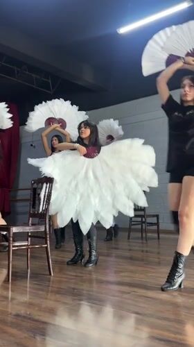 Feather fan dance rehearsal underway in a Mexican studio