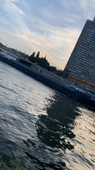 Afternoon along the Meuse: river traffic, flags, and public art