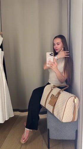 Woman takes selfies in Kyiv dressing room