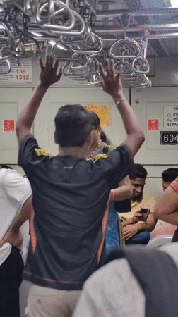 Hanging on during the Mumbai local train rush