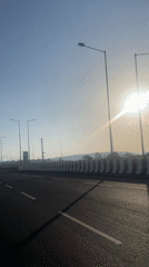 Highway travel recorded in sunny conditions near Dhargal, India