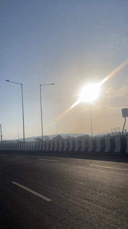 Highway travel recorded in sunny conditions near Dhargal, India