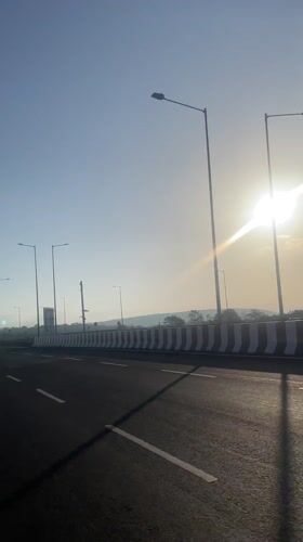 Highway travel recorded in sunny conditions near Dhargal, India