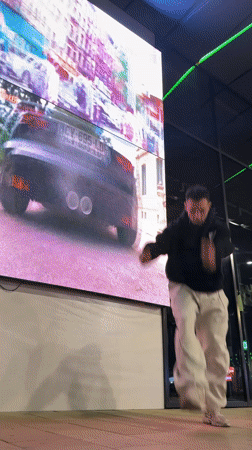 Street performer attempts acrobatics outside Shumen shops, multiple fails