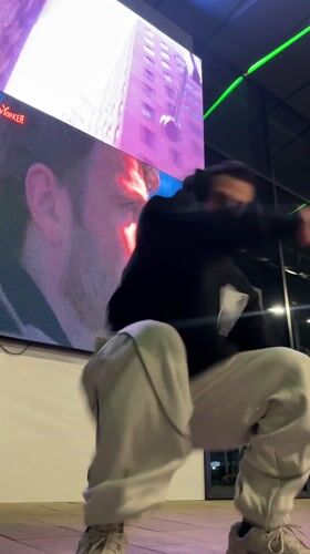 Street performer attempts acrobatics outside Shumen shops, multiple fails