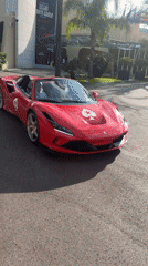 Red Ferrari convertible spotted driving through Monaco streets
