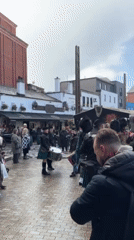 Scottish bagpipe band performs in Belfast public square