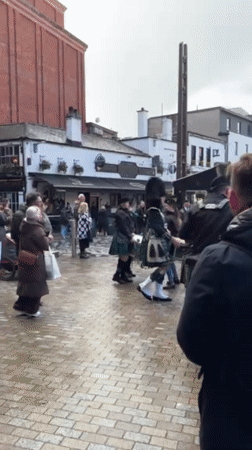 Scottish bagpipe band performs in Belfast public square