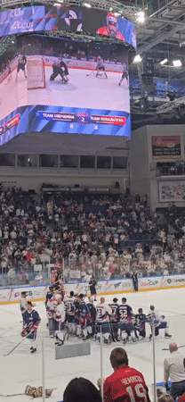 Ice hockey action inside a packed arena in Mytishchi