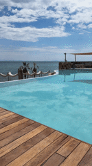Luxury resort pool overlooking ocean documented in Greece