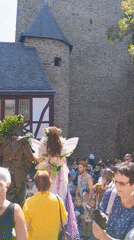Fairy and forest creature costumes outside Altena's castle