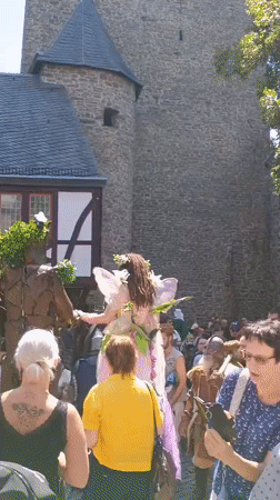 Fairy and forest creature costumes outside Altena's castle