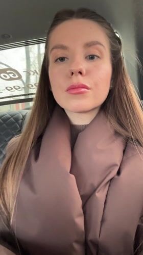 Woman applies makeup, takes selfie in car in Klin