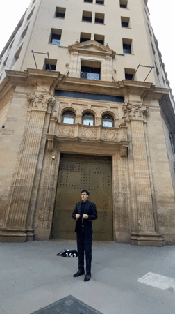 Man in suit performs street singing near Buenos Aires landmarks