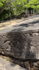 Tourists document ancient Buddhist ruins at Polonnaruwa heritage site