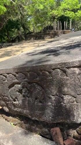 Tourists document ancient Buddhist ruins at Polonnaruwa heritage site