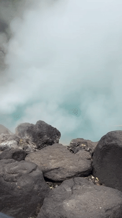 Tourists document morning visit to Beppu's famous Hell hot springs