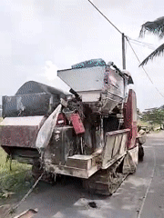 Combine harvester parked roadside in Dayahbaro, Indonesia
