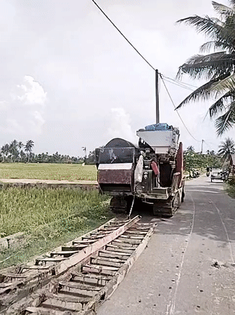 Combine harvester parked roadside in Dayahbaro, Indonesia