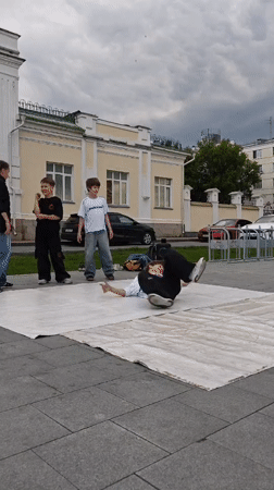 Breakdancer mid-inversion at an outdoor performance in Yekaterinburg