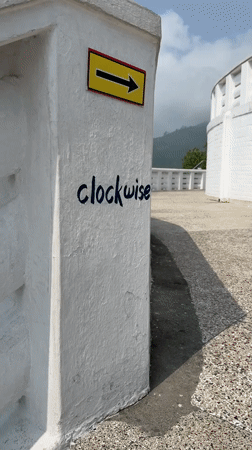 Directional signage captured at scenic viewpoint in Pokhara, Nepal