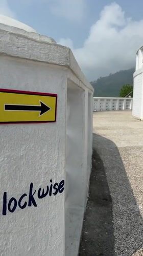 Directional signage captured at scenic viewpoint in Pokhara, Nepal