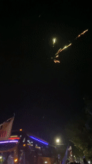Kediri football fans flood the streets with flares and flags