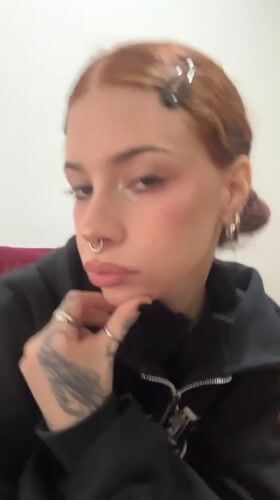 Red-haired woman in black hoodie photographed in Buenos Aires