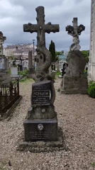 Cemetery documentation shows Cyrillic gravestone under cloudy skies