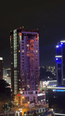 Colorful building lights illuminate Khabarovsk cityscape at night