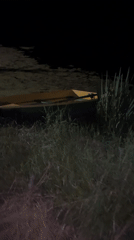 Empty boat docked in murky waters near Vasilyevo, Russia