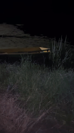Empty boat docked in murky waters near Vasilyevo, Russia
