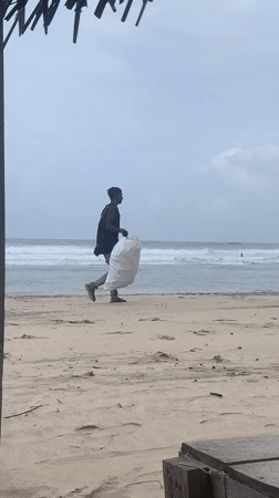 Beach cleanup crew works the southern Sri Lanka shoreline
