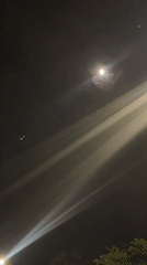Moonlit street scene documented in Jiulongpo District, China