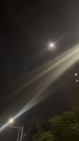 Moonlit street scene documented in Jiulongpo District, China