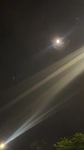 Moonlit street scene documented in Jiulongpo District, China